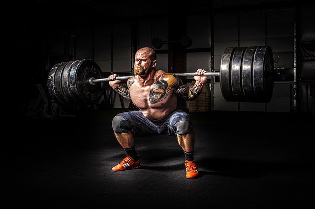 man strength training squat